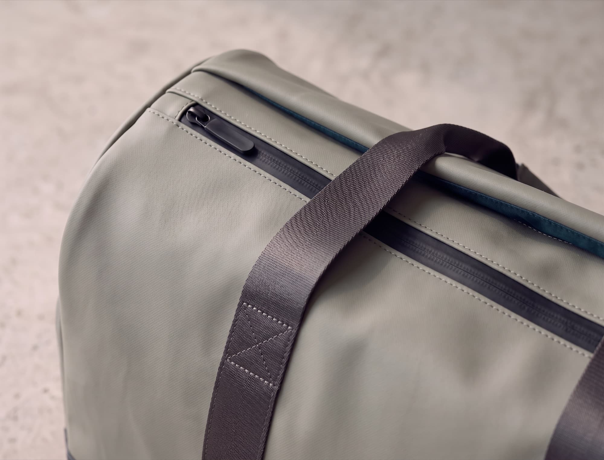 The top lid opening, zip set inside the top panel