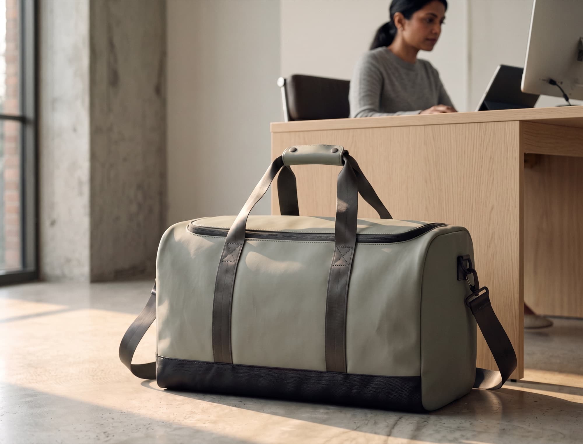 The duffel under a desk through the working day