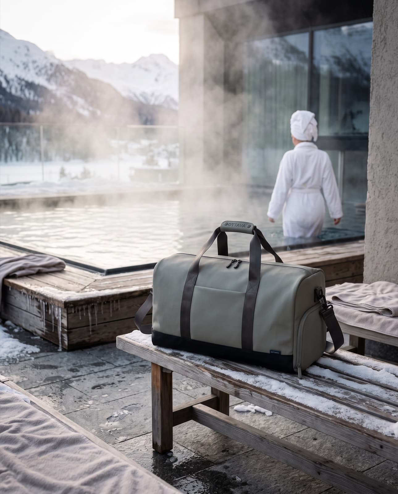 Duffel 50 beside a steaming alpine thermal pool